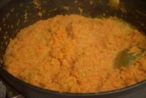 milk-carrot mix in wok